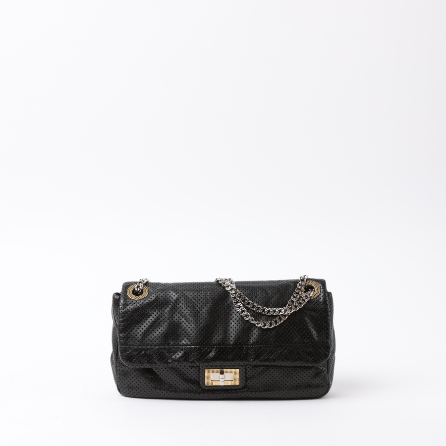 Vintage CHANEL Classic Perforated Drill Flap Bag - A Retro Tale